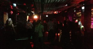 Nightclub dance floor interior — illustrating typical hard-surface venue acoustics requiring engineered treatment in Thai concrete-shell buildings