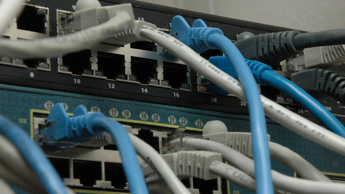 Stack of managed network switches with PoE — typical AV-line switching infrastructure for networked audio