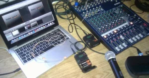 Professional wireless microphone setup with Sennheiser EW G3 and Shure PGW24-PG58 systems — illustrating wireless RF audio equipment subject to NBTC Thailand regulation